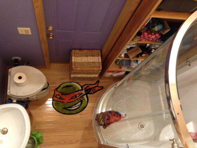 tiny house bathroom with shower, sink, and toilet